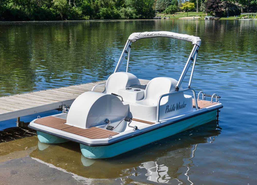 boat in water with lake in background